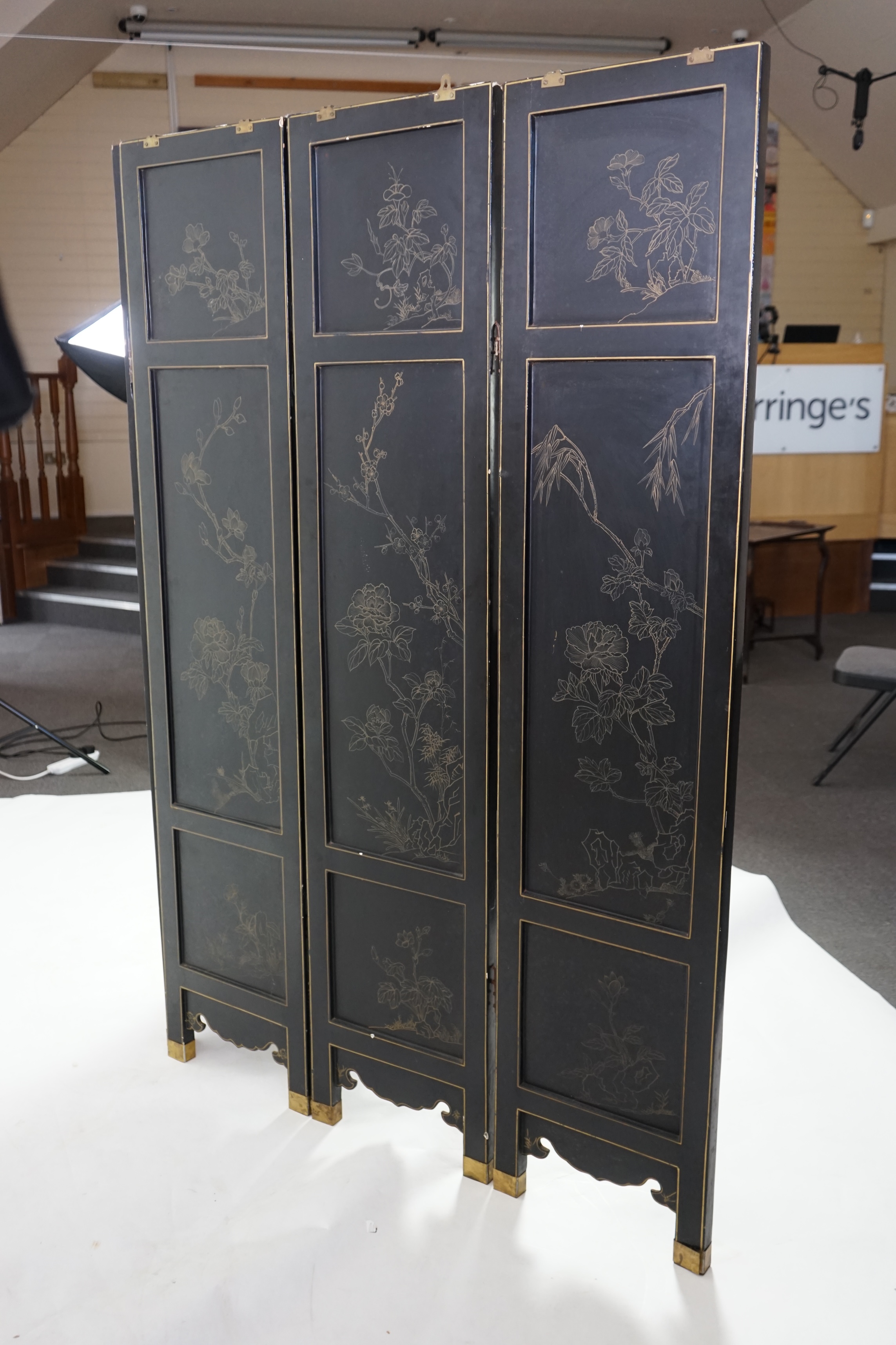 A Chinese tixi lacquer and carved soapstone overlaid six panel screen, mid 20th century